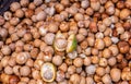 Heap of freshly peeled betal nuts with one cut open, Kadenahalli, Karnataka, India