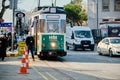 Kadikoy istanbul city view with blue small train tram with crowd people and cars.