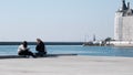 Kadikoy shore and look at the marmara sea with breakwater and haydarpasa main train station background. Royalty Free Stock Photo