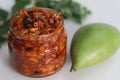 Kadumanga achar. Kerala style instant mango pickle made of chopped unripe raw totapuri mangoes, with mustard leaves, curry leaves Royalty Free Stock Photo