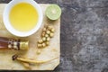 Kaempferia, honey, and lemon are placed on wooden table Royalty Free Stock Photo