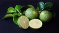 Kaffir Lime or Citrus hystrix. Some are whole, some have been sliced Royalty Free Stock Photo