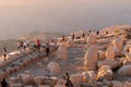 Kahta, Adiyaman, Turkey - September 14 2020: Commagene statue ruins on top of Nemrut Mountain with dramatic sunset. Stone heads at Royalty Free Stock Photo