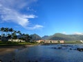 Kahului Bay with Hotel, coconut trees, and Iao Valley and surrounding mountains