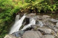 Side view of a waterfall cascading over a rock ledge, New Zealand