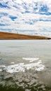 Fozen River Blue Sky Yellow Grassland in Bayanbulak  in early Spring Royalty Free Stock Photo