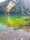 Kaindy mountain lake in Kazakhstan. Natural, forest. Royalty Free Stock Photo