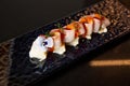 Kaiseki sushi platter combo set on the serving board in the fine dining Japanese restaurant