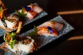 Kaiseki sushi platter combo set on the serving board in the fine dining Japanese restaurant