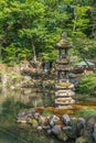 Kaiseki-to lantern in Hisagoike pond at Kenrokuen Garden. Kanazawa City, Japan.