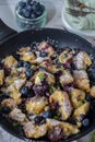 Kaiserschmarrn - traditional austrian pancake dessert with blueberries Royalty Free Stock Photo