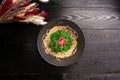 Kaiso with nut sauce and sesame on a wooden background