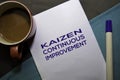 KAIZEN. Continuouse Improvement text on the paper isolated on office desk background. Japanese Concept Royalty Free Stock Photo