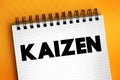 Kaizen - Japanese term meaning `change for the better` or `continuous improvement, text concept on notepad
