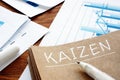 Kaizen sign with business report and charts