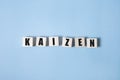 Kaizen - words from wooden blocks with letters, a Japanese business philosophy kaizen concept, white background