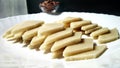 Kaju Katli is a Diamond shape Indian sweet made using cashew sugar and mava, served in a plate isolated on white background. Royalty Free Stock Photo