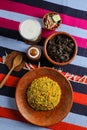 Kala bhuna khichuri with salad, borhani and baked gulab jamun served in dish isolated on mat top view of indian and bangladeshi