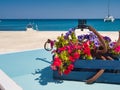 Colourful flowerbed with anchor on modern tropical pier