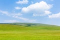 Sky, clouds and green grassland Royalty Free Stock Photo