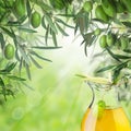 Kalamata olives, bokeh light, green leaves and olive oil jar Royalty Free Stock Photo