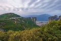 Kalampaka Town between two rocks with Holy Trinity Monastery on a top, Meteora, Greece Royalty Free Stock Photo