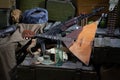 Kalashnikov AK 47 with ammunitions and vodka on army box background Royalty Free Stock Photo