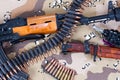 Kalashnikov AKM with ammunitions, hand grenade and bayonet on camouflaged uniform background Royalty Free Stock Photo