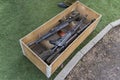 Kalashnikov assault rifles in wooden box. Arms trade. illegal sale of weapons. An automatic weapon with a sniper scope in wood box