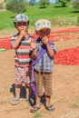 KALAW, MYANMAR - NOVEMBER 25, 2016: Village children and drying chilli peppers in the area between Kalaw and Inle, Myanm