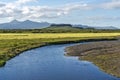 Kalda river flow in western Iceland and Eldborg volcano crater in the center of picture Royalty Free Stock Photo