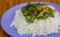 Kale with crispy pork rice on wood table