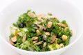 Kale salad in white bowl on white Royalty Free Stock Photo