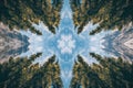 Kaleidoscope reflection of pine trees and peaks under a bright sky showcasing natures symmetry and beauty Royalty Free Stock Photo