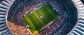 A kaleidoscopic aerial view of a stadium, with rows of colorful seats surrounding the brilliant green playing field