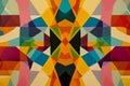 Kaleidoscopic symmetry with mirrored, colorful geometric patterns creating a psychedelic effect.