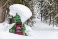 Kali the Ramsaurier, likeable, snow covered, green dinosaur mascot of ski school at ski region Ramsau Dachstein, Steiermark. Royalty Free Stock Photo