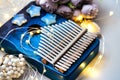 Kalimba is a musical instrument native to Africa. Music box with beautiful decor, lighting, a bouquet of flowers Royalty Free Stock Photo