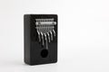 Kalimba small percussion musical instrument with metal keys and hole, dark brown color isolated on white background Royalty Free Stock Photo