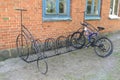 Bicycle parking with parked bike near brick building Royalty Free Stock Photo