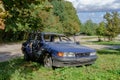 Wrecked old car. Abandoned car. Stolen car. Mitsubishi blue. Passenger car