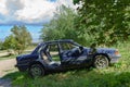 Wrecked old car. Abandoned car. Stolen car. Mitsubishi blue. Passenger car Royalty Free Stock Photo