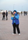 KALININGRAD, RUSSIA. The female volunteer of te FIFA World Cup of 2018 with the megaphone in handsh