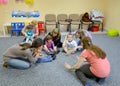 KALININGRAD, RUSSIA. Small children are engaged with the tutor and parents in studio of creative development