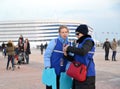 KALININGRAD, RUSSIA. Volunteers of the FIFA World Cup of 2018 against the background of Baltic Arena stadium Royalty Free Stock Photo