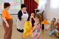 KALININGRAD, RUSSIA. The girl gets a gift from a bag. A holiday in kindergarten