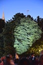KALININGRAD, RUSSIA - AUGUST 15, 2021: Light portrait of Immanuel Kant on tree crowns