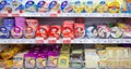 Processed cheese on shelves of supermarket