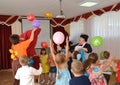 KALININGRAD, RUSSIA. Children catch balloons. A holiday in kindergarten