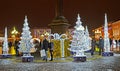 KALININGRAD, RUSSIA. People walk among the shining fir-trees in the winter evening. Victory Square